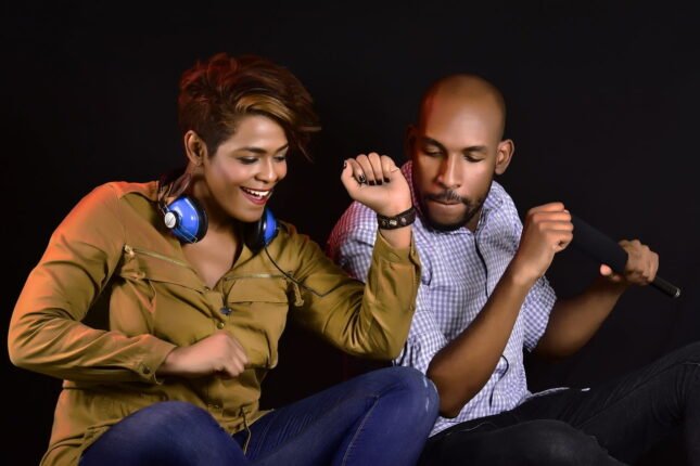 Husband and wife listening to music