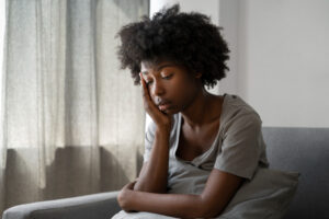 A black lady looking sad