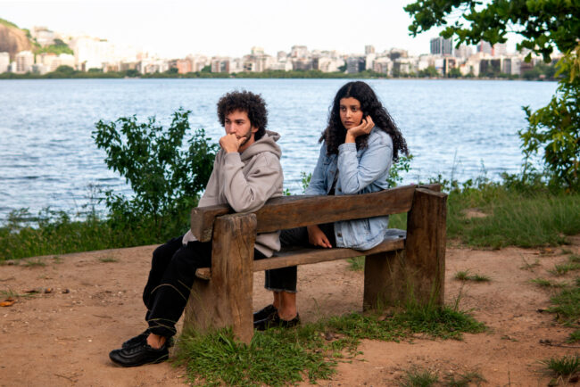 Couple thnking as seated on chair